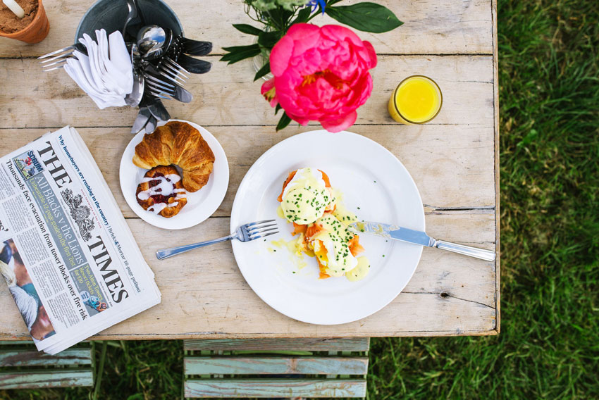 brunch-newspaper-eggs-royale-pastries Brunch at Pennard Orchard for Glastonbury Festival